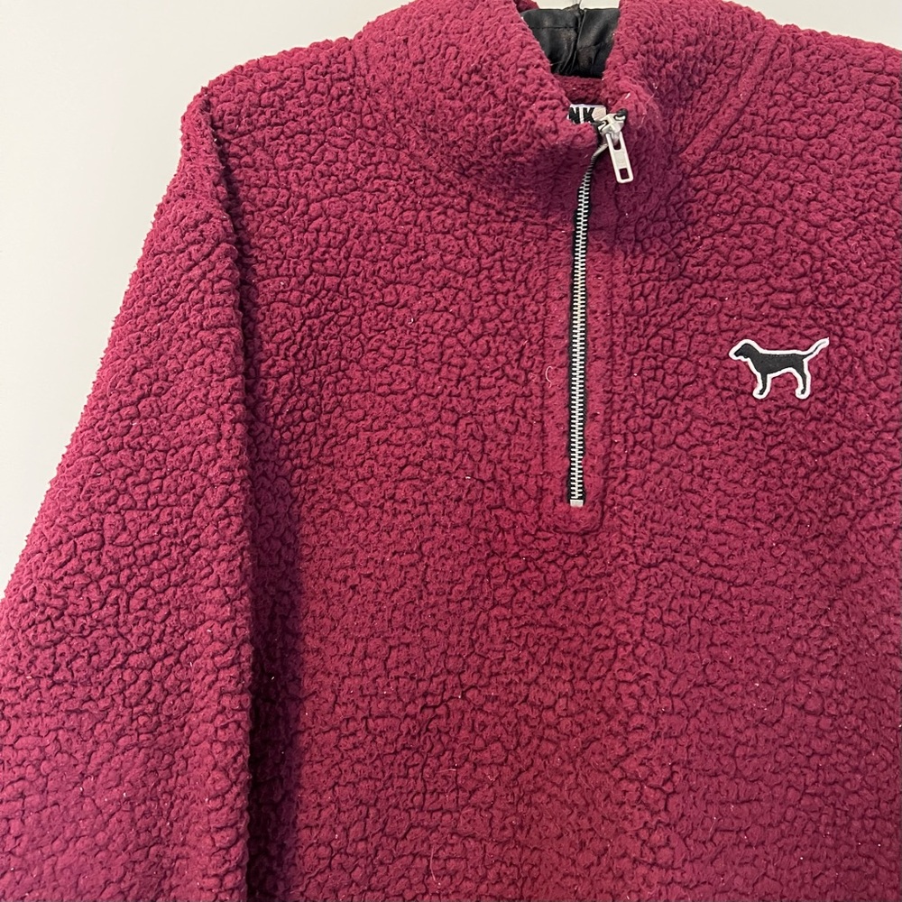 PINK pullover.
